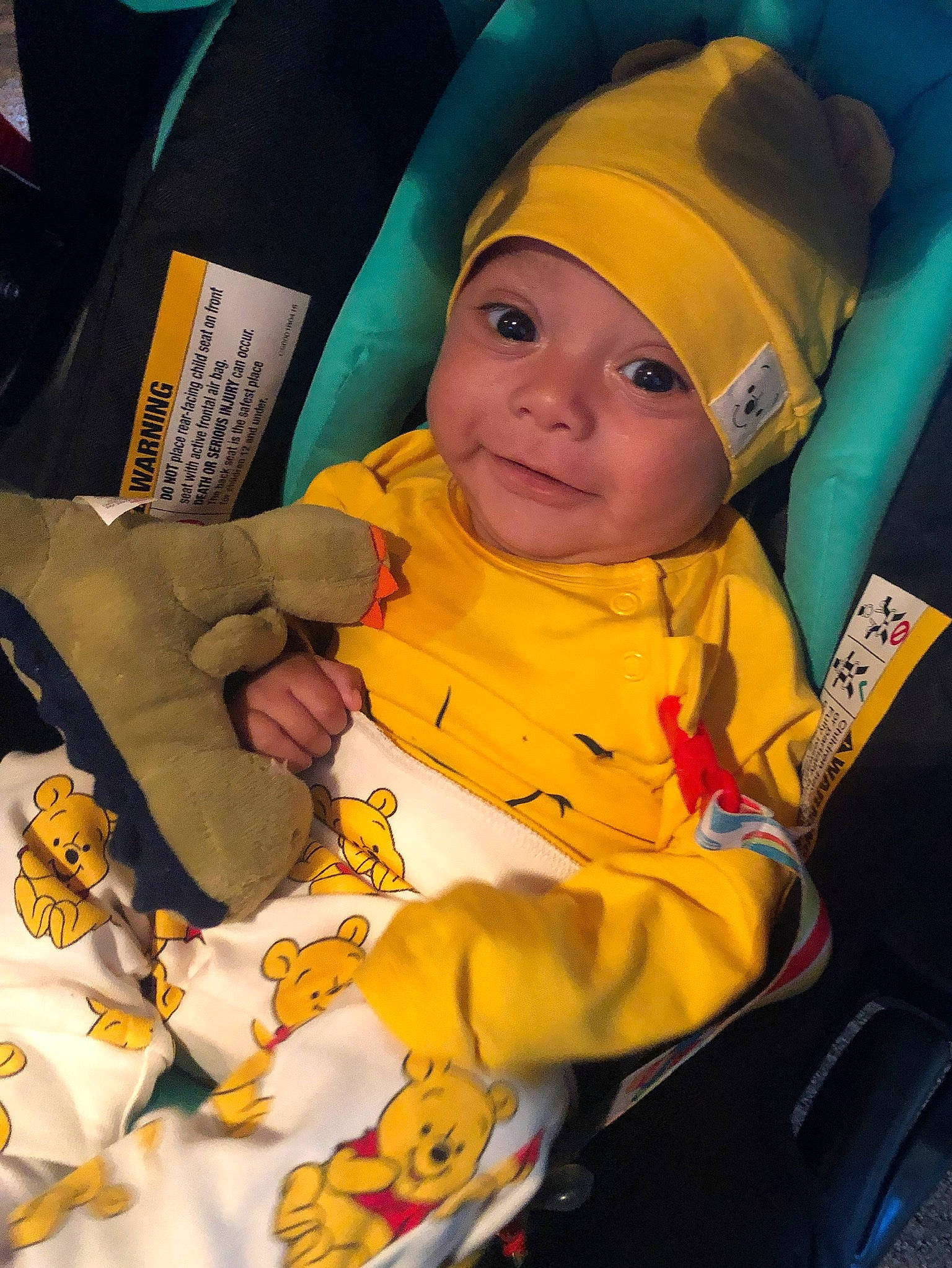 Diego is registered to the contest to win money with this photo: baby, child, fun, headwear, person, smile, toddler, yellow