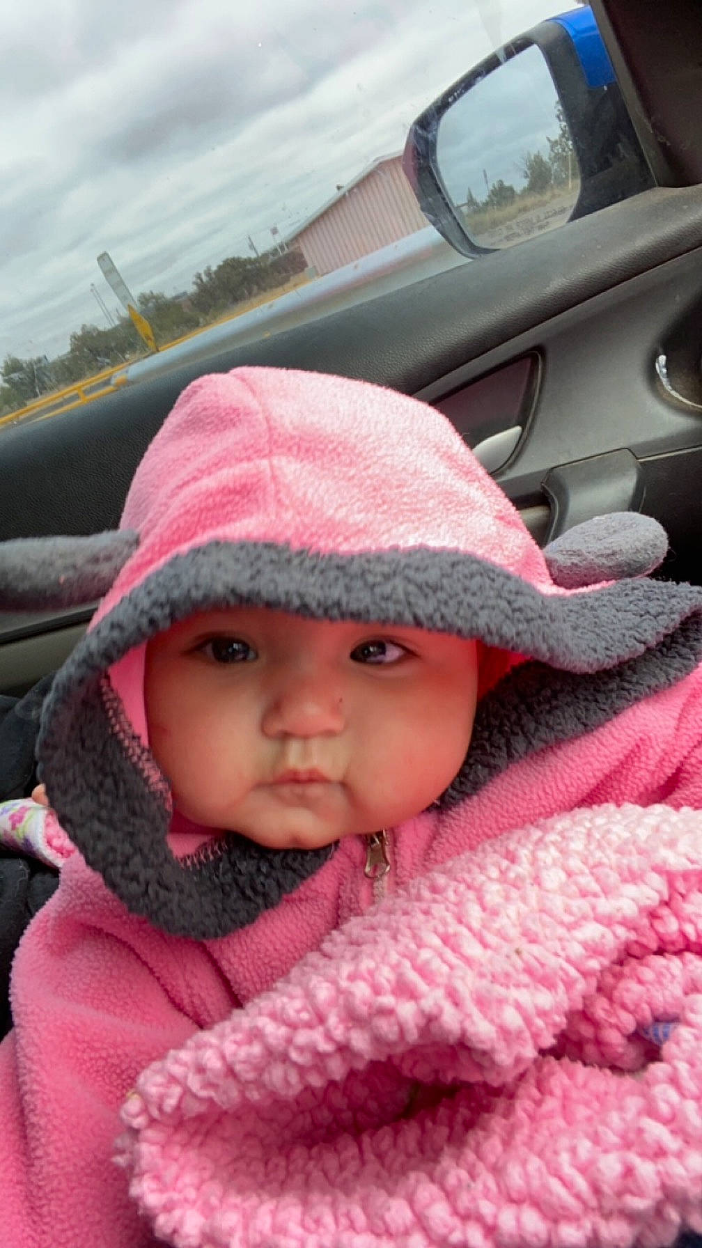 Aiyana joined the competition — help win amazing prizes! automotive_exterior, baby, cap, cheek, child, cloud, cool, family_car, fashion_accessory, headgear, headwear, knit_cap, lip, magenta, motor_vehicle, person, pink, skin, sky, toddler
