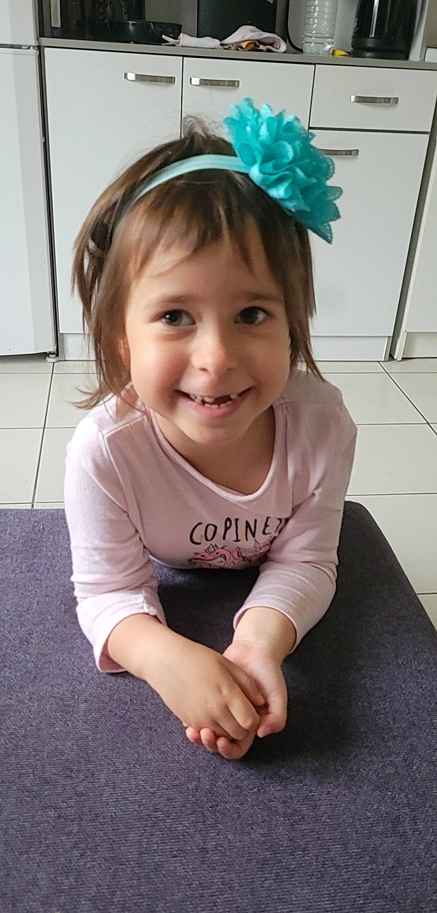 Liya participe au concours pour gagner de l'argent avec cette photo : baby, baby_toddler_clothing, cheek, eye, eyebrow, face, flooring, fun, hair, hairstyle, happy, head, headband, headpiece, iris, joy, person, skin, sleeve, smile