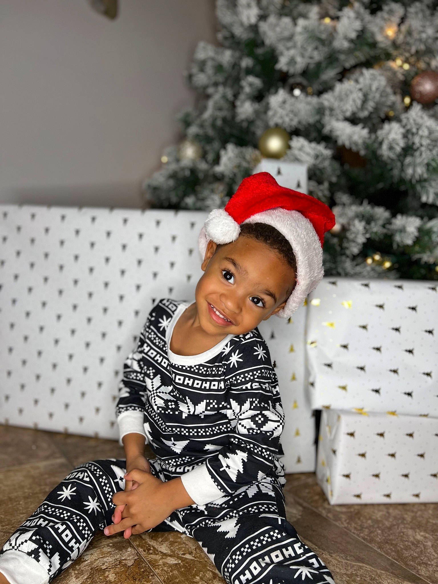 Kaden joined the competition — help win amazing prizes! baby_toddler_clothing, child, christmas, christmas_decoration, christmas_tree, comfort, conifer, event, fun, happy, holiday, joy, knee, ornament, pattern, person, sitting, sleeve, smile, thigh