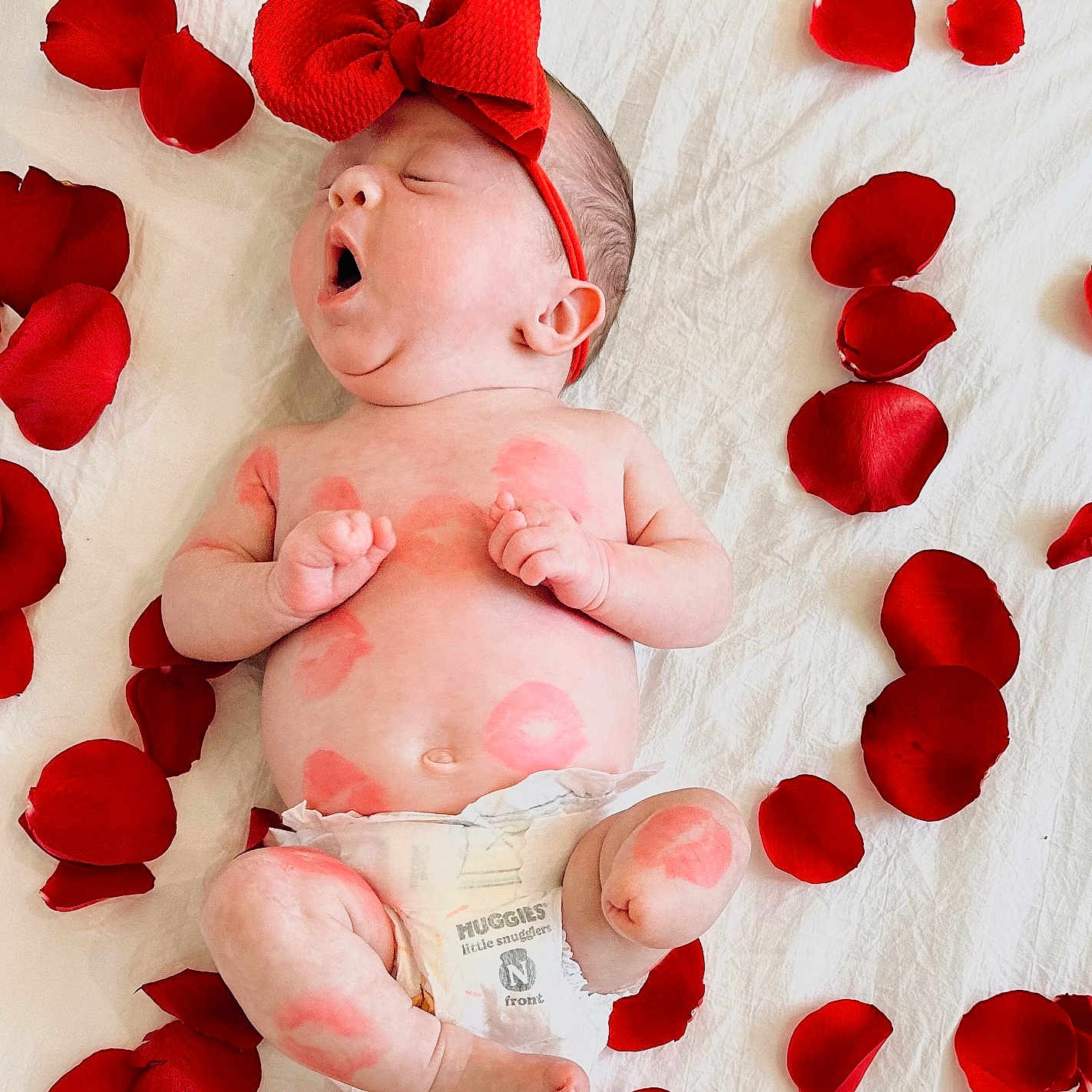 Saylor joined the competition — help win amazing prizes! baby, diaper, face, flower, head, newborn, person, petal, photography, plant, portrait, rose, symbol, yawning