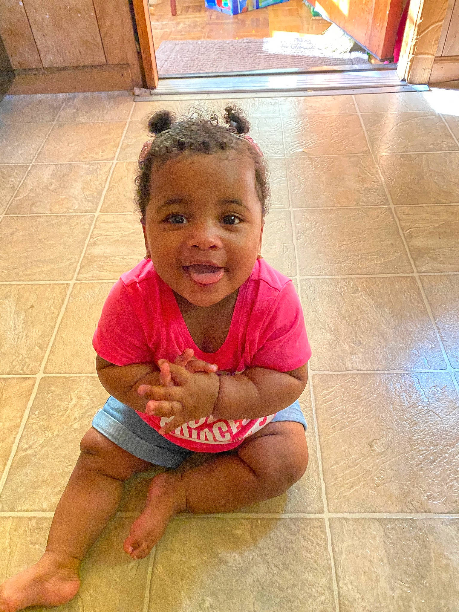 Janeé is registered to the contest to win money with this photo: cheek, child, floor, flooring, person, sitting, skin, smile, tile, toddler, vacation