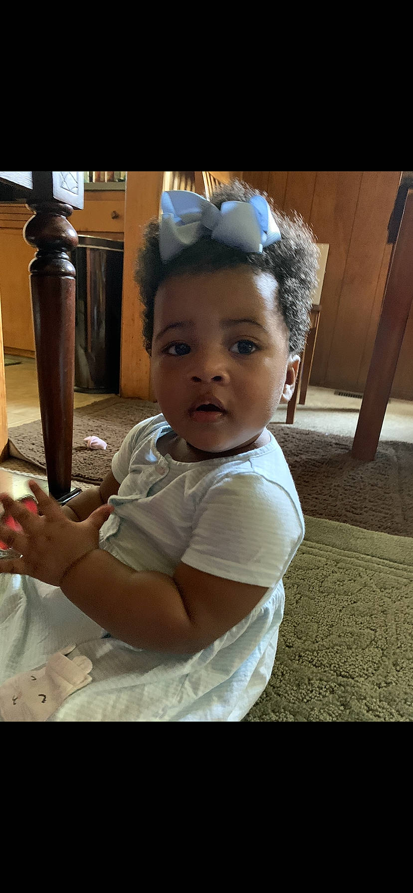 Janeé is registered to the contest to win money with this photo: arm, baby, black_hair, cheek, child, cool, eye, face, forehead, hair_accessory, hairstyle, head, headband, neck, nose, person, sitting, skin, smile, snapshot