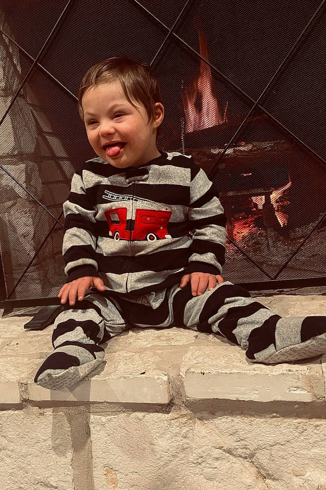 William is registered to the contest to win money with this photo: baby, baby_toddler_clothing, carmine, child, concrete, flash_photography, floor, flooring, fun, pattern, person, play, road_surface, shadow, sitting, sleeve, smile, t_shirt, tints_and_shades, toddler