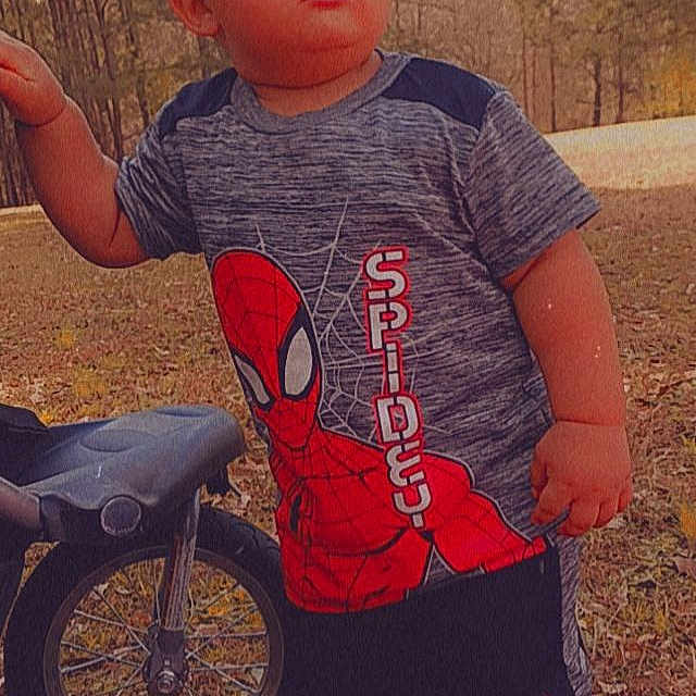 Stephon is registered to the contest to win money with this photo: baby_toddler_clothing, bicycle_clothing, bicycle_handlebar, bicycle_helmet, bicycle_wheel, bicycles_equipment_and_supplies, cool, eyewear, facial_expression, grass, happy, head, leaf, people_in_nature, sleeve, t_shirt, tire, toddler, tree, wheel