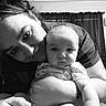 black_and_white, baby, adult, hug, smile, portrait, indoor, curtain, closeup, face, person, love, child, holding, candid, toddler, expression, monochrome, family, affection