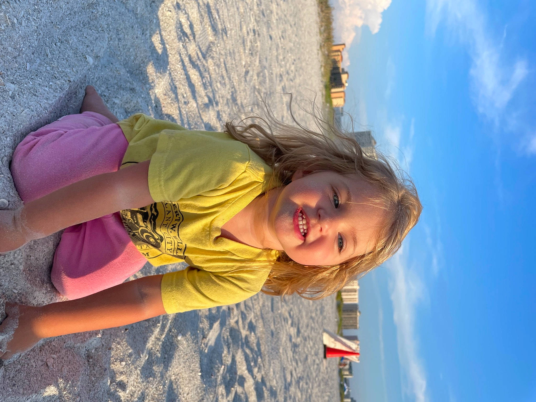 Everlei is registered to the contest to win money with this photo: arm, azure, beach, blond, cloud, elbow, electric_blue, fun, happy, human_leg, joy, landscape, leisure, people_in_nature, person, recreation, sky, smile, thigh, toddler