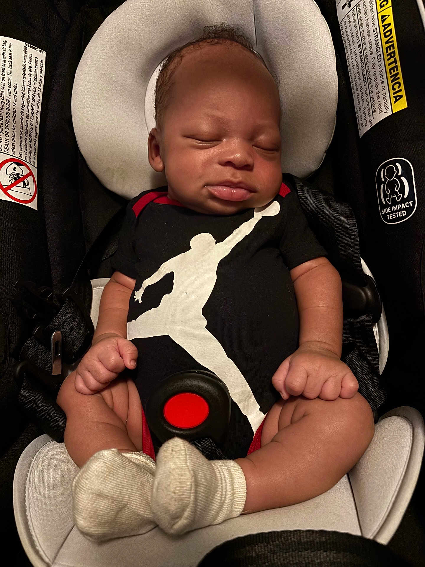 Robert is registered to the contest to win money with this photo: baby, infant, car_seat, onesie, sleeping, child, socks, safety, rest, cute, straps, padding, newborn, portrait, peaceful, clothing, babywear, head_support, indoor, seatbelt