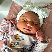 Emersyn joined the competition — help win amazing prizes! newborn, baby, sleeping, headband, bow, floral_outfit, pink_blanket, soft_texture, peaceful, infant, cute, portrait, closeup, indoor, child, resting, small_hands, cozy, adorable, sleep