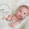 Roma is registered to the contest to win money with this photo: baby, infant, two_months, blanket, soft_texture, white, fur, portrait, cute, child, newborn, skin, face, hand, lying_down, cozy, warm, eyes, expression, closeup