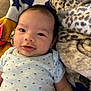 Eric joined the competition — help win amazing prizes! baby, infant, blanket, star_pattern, onesie, smile, face, lying_down, soft_texture, leopard_print, blue, white, yellow, red, cute, child, young, cozy, homedecor, person
