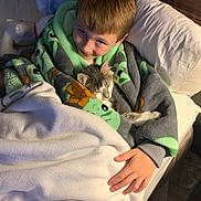 Miracle is registered to the contest to win money with this photo: child, cat, blanket, bed, pillow, sleeping, cozy, indoor, comfort, cuddling, young, person, feline, cute, resting, soft, warm, happy, casual, relaxing