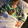 child, cat, blanket, bed, pillow, sleeping, cozy, indoor, comfort, cuddling, young, person, feline, cute, resting, soft, warm, happy, casual, relaxing