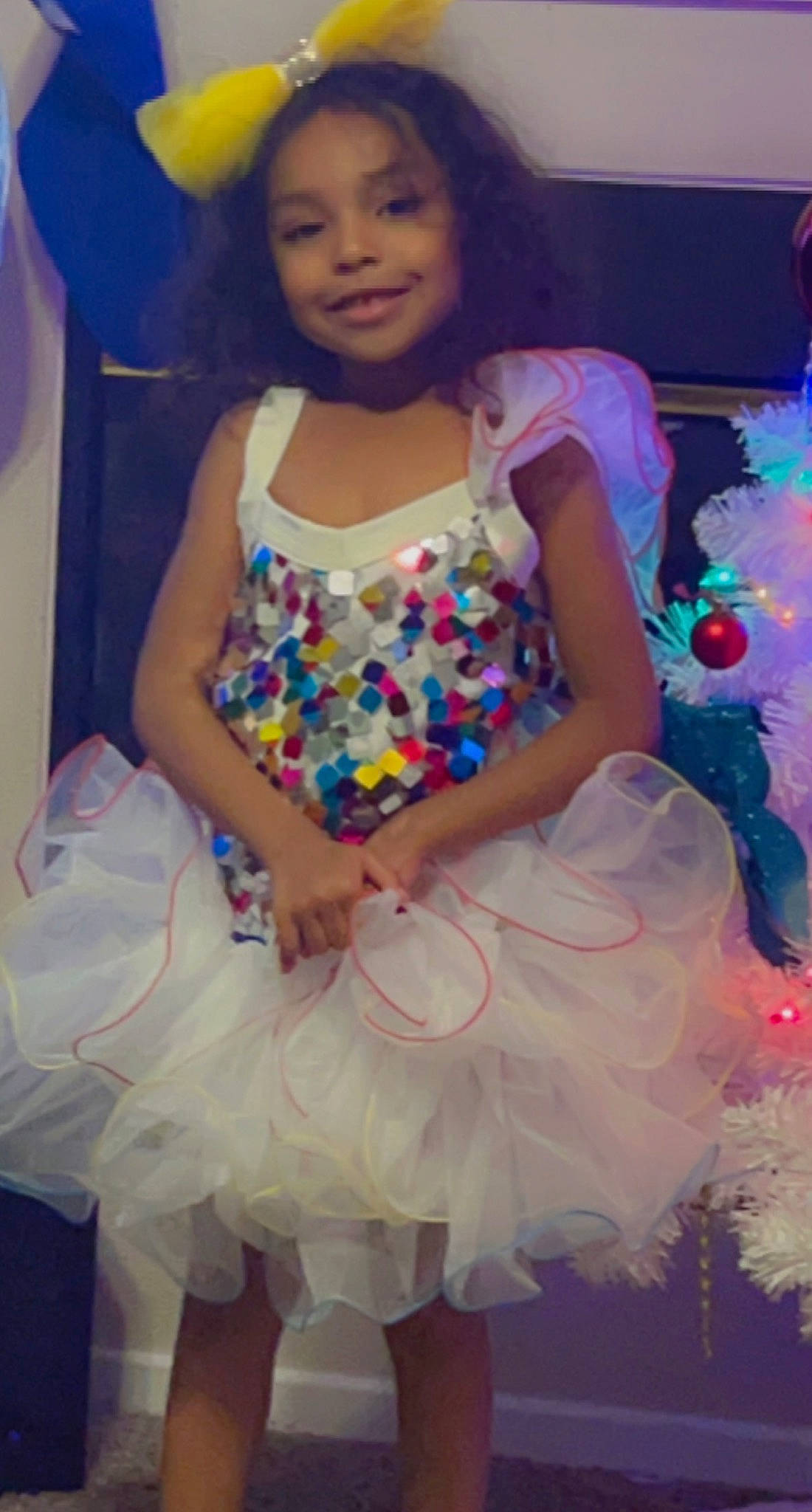 Zayla joined the competition — help win amazing prizes! beauty, child, costume, entertainment, event, fashion_design, formal_wear, fun, hair, happy, human_leg, joy, magenta, pattern, person, pink, ruffle, sitting, smile, thigh