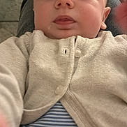 Jules participe au concours pour gagner de l'argent avec cette photo : baby, child, face, person, cardigan, clothing, striped_shirt, closeup, indoors, curious, cute, infant, portrait, skin, eyelashes, nose, mouth, head, button, sitting