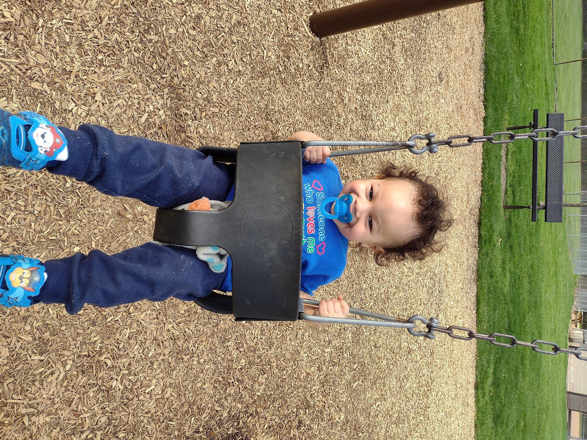 Jaylen joined the competition — help win amazing prizes! asphalt, baby, baby_toddler_clothing, child, city, electric_blue, fun, grass, joy, leisure, people_in_nature, person, play, playground, recreation, shadow, sitting, soil, swing, toddler