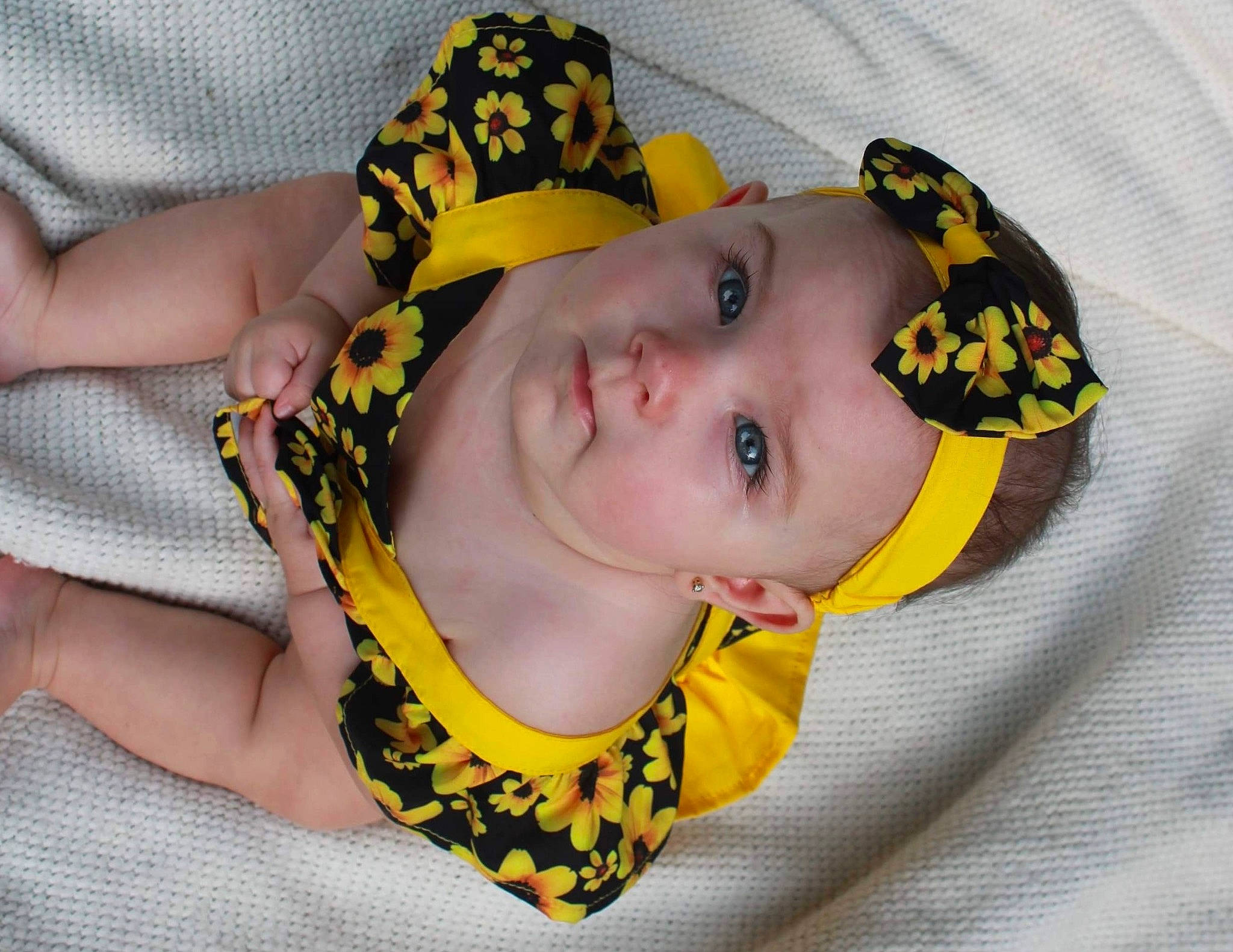 Legion is registered to the contest to win money with this photo: baby, baby_products, baby_toddler_clothing, eye, eyelash, face, fashion_accessory, hair_accessory, hand, happy, hat, headgear, headwear, jewellery, pattern, person, sleeve, sun_hat, textile, toddler