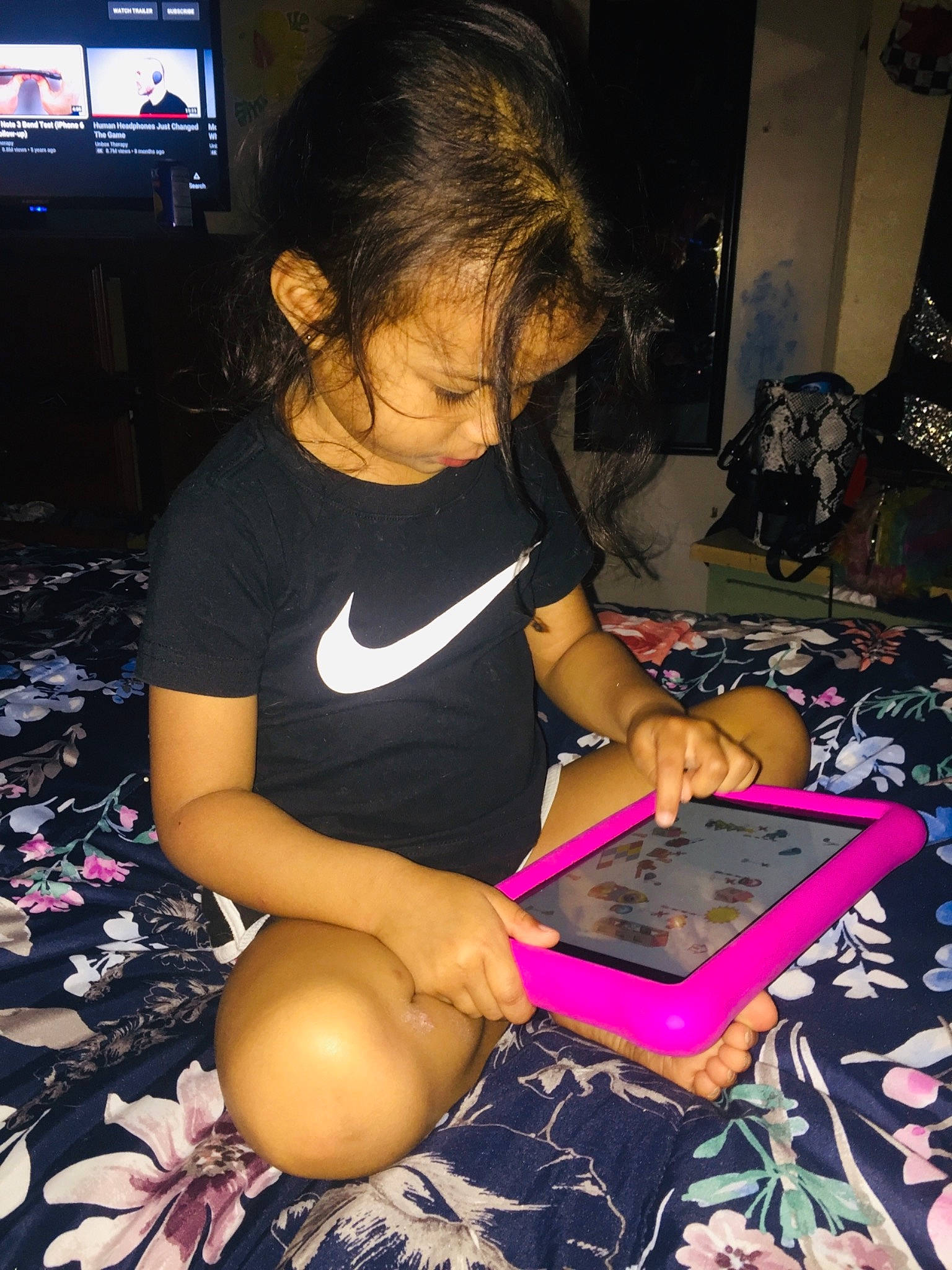 Kyra is registered to the contest to win money with this photo: adaptation, arm, artist, audio_equipment, black, child, finger, fun, gadget, hair, hand, human_leg, nail, person, purple, room, snapshot, t_shirt, television, thigh