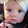 baby, blue_eyes, bow, car_seat, child, closeup, cute, expression, face, hands, headwear, indoors, infant, person, portrait, purple_clothing, seatbelt, skin, soft_lighting, young_child