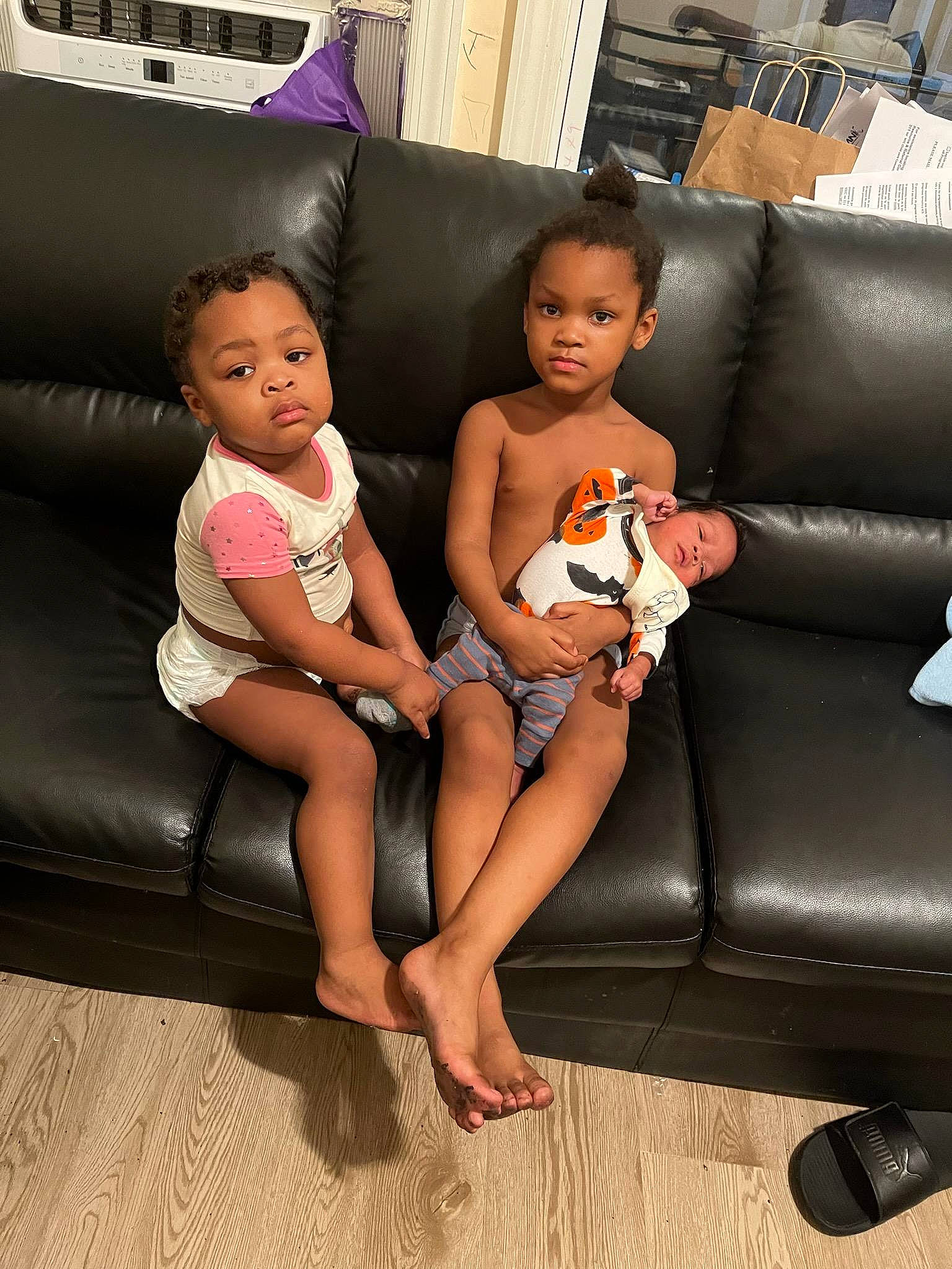 Jasmin is registered to the contest to win money with this photo: baby, barefoot, black_hair, comfort, couch, finger, floor, flooring, foot, fun, happy, human_leg, lap, leg, leisure, living_room, person, sitting, skin, thigh