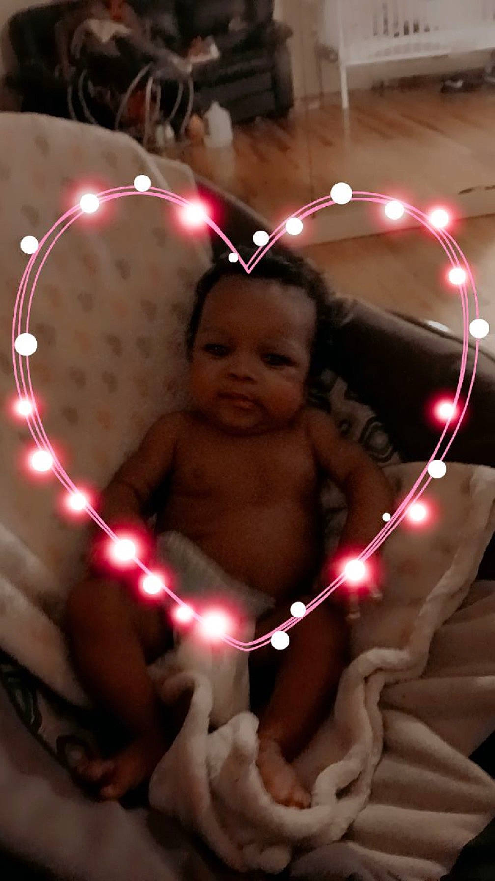 Prince is registered to the contest to win money with this photo: baby, chest, child, circle, event, fun, happy, head, holiday, light, ornament, party_supply, person, thumb, toddler