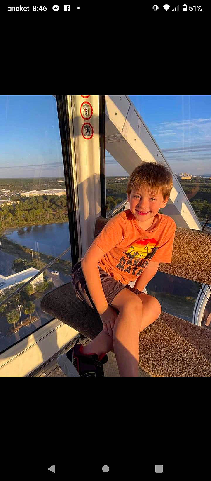 Adrian joined the competition — help win amazing prizes! automotive_exterior, city, eyewear, fun, happy, human_leg, joy, leg, leisure, person, recreation, sandal, shorts, sitting, sky, smile, t_shirt, thigh, toddler, travel