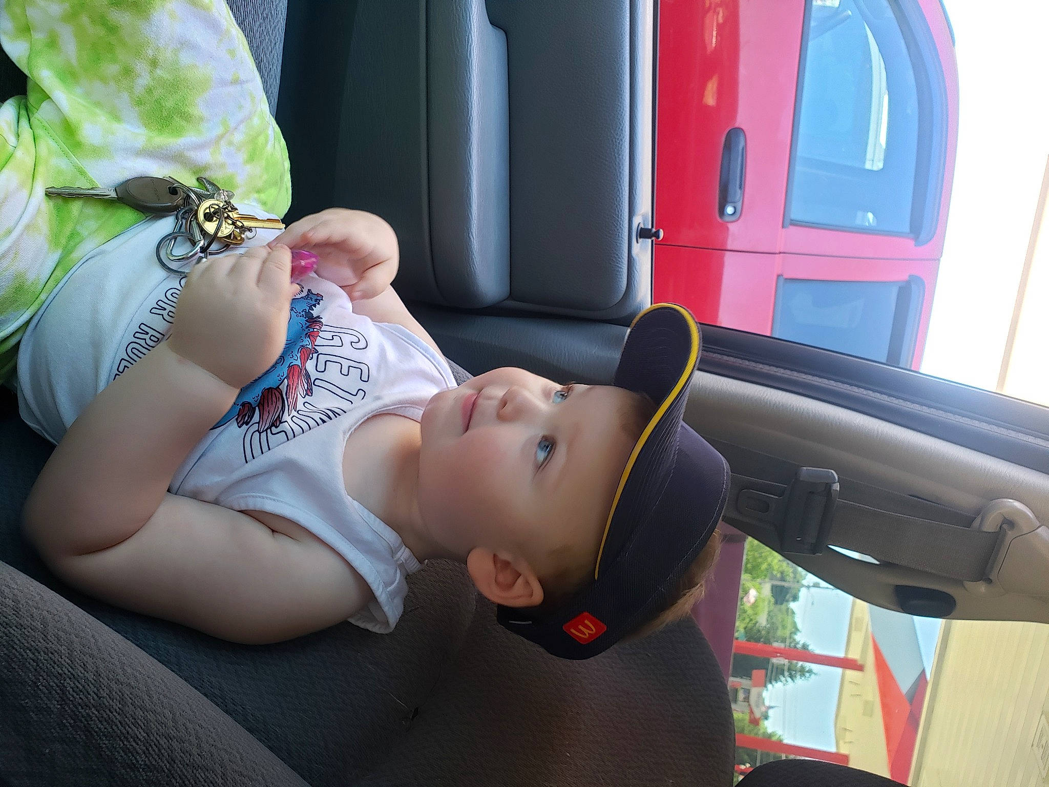 Raylan is registered to the contest to win money with this photo: auto_part, automotive_design, automotive_exterior, car, car_seat, door, eyewear, family_car, finger, grass, head_restraint, headwear, human_leg, motor_vehicle, person, steering_wheel, sunglasses, thigh, tree, vehicle