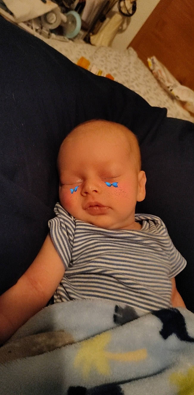 Maison joined the competition — help win amazing prizes! baby, baby_toddler_clothing, cheek, child, chin, comfort, eye, eyebrow, finger, head, iris, linens, lip, neck, nose, pattern, person, sitting, skin, sleeve