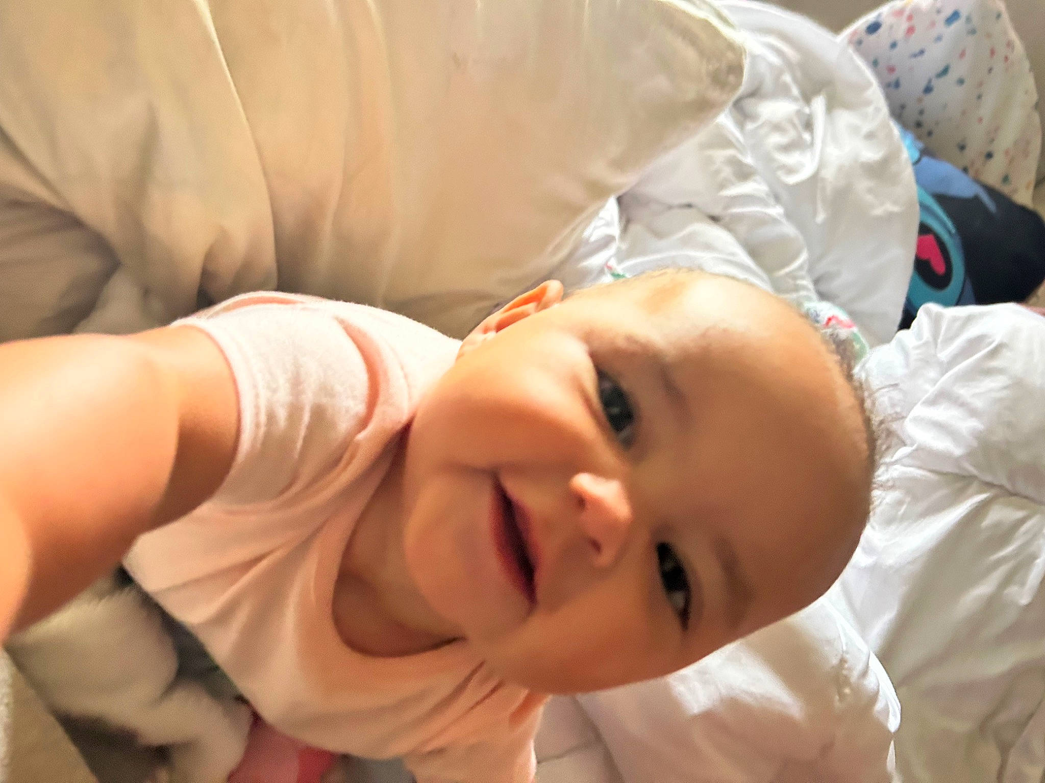 Myah is registered to the contest to win money with this photo: baby, baby_toddler_clothing, cheek, child, chin, comfort, elbow, eyelash, happy, human_body, mammal, mouth, nose, person, room, skin, sleeve, smile, thumb, toddler