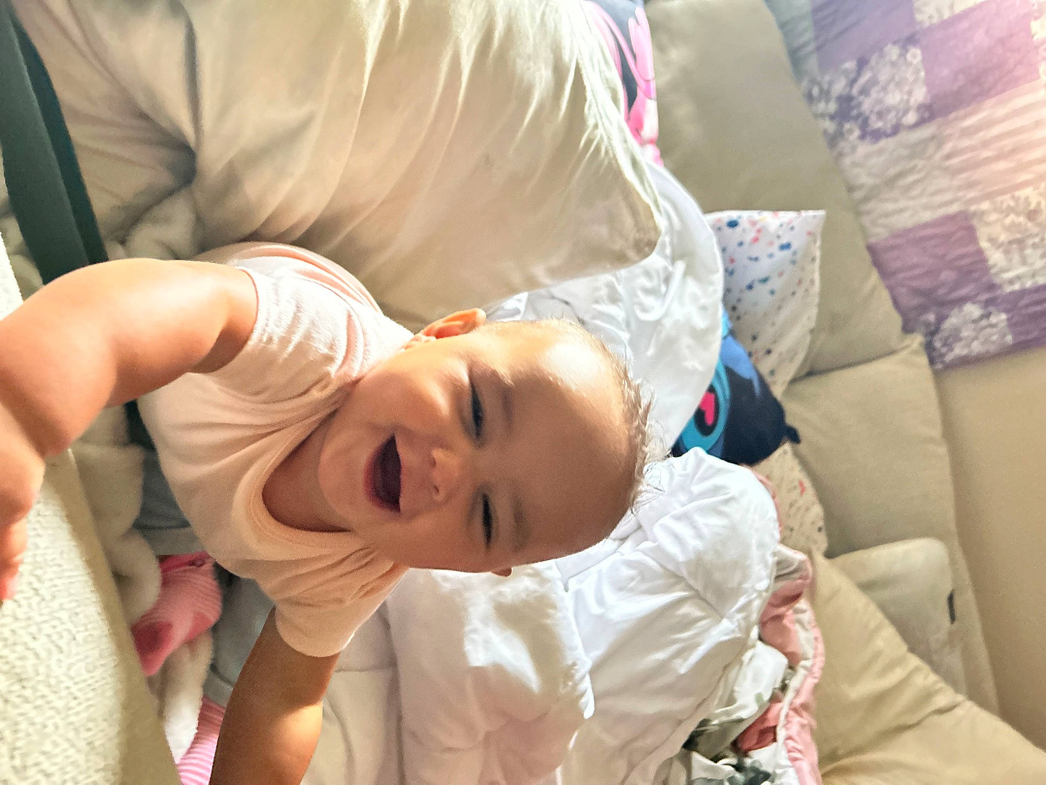 Myah is registered to the contest to win money with this photo: abdomen, baby, cheek, chest, child, comfort, elbow, event, eye, eyelash, fun, gesture, hair, happy, linens, nap, person, room, smile, sunglasses