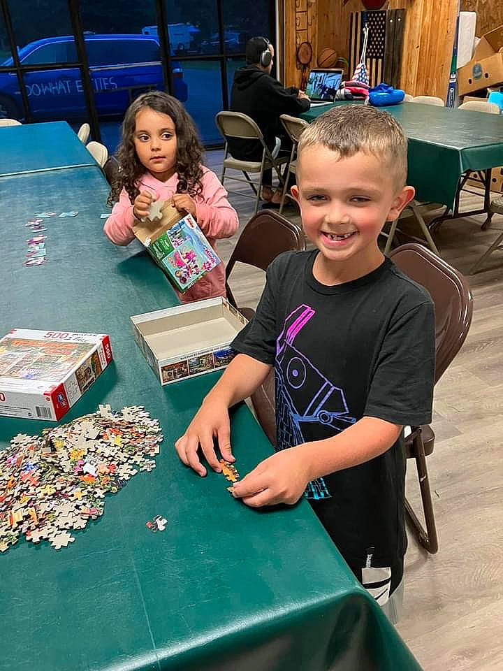 Deklan is registered to the contest to win money with this photo: chair, child, education, event, flooring, fun, furniture, games, indoor_games_and_sports, joy, learning, leisure, person, publication, recreation, room, smile, summer, t_shirt, table