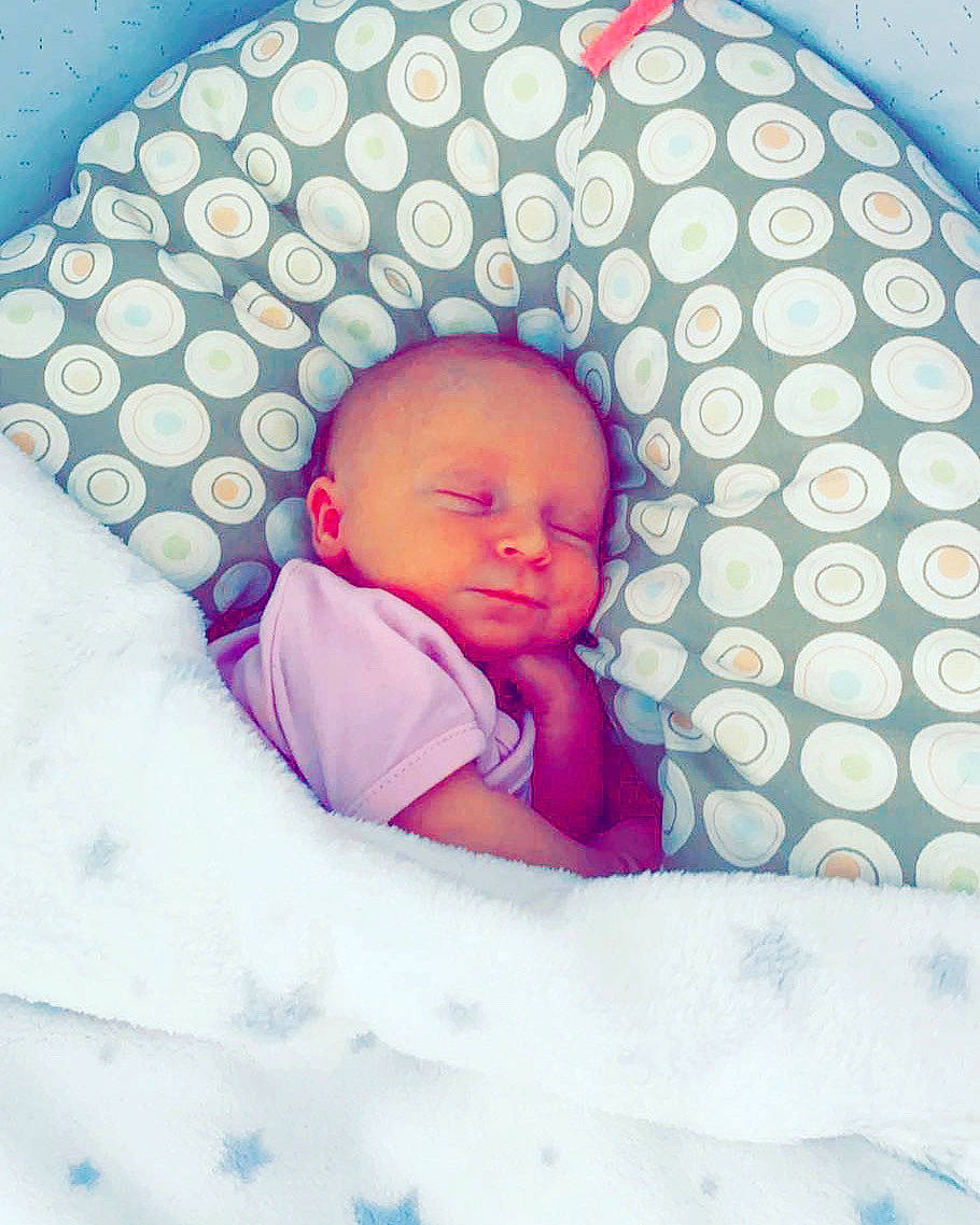 Lya participe au concours pour gagner de l'argent avec cette photo : azure, baby, baby_sleeping, baby_toddler_clothing, blue, cheek, child, comfort, eye, facial_expression, head, linens, pattern, person, pink, product, purple, skin, sleeve, textile