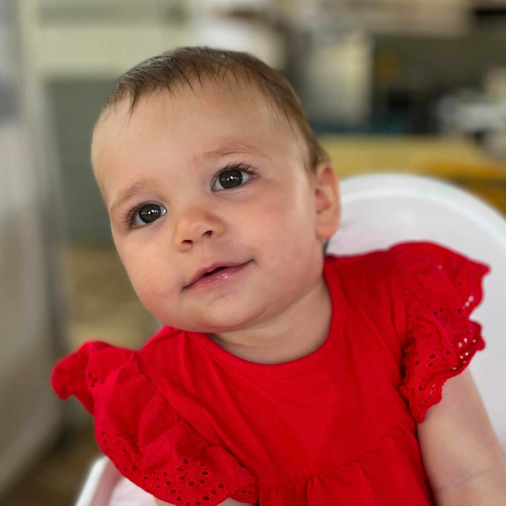Catalina a rejoint le concours — aidez-le/la à gagner de superbes lots ! baby, child, childhood, clothing, cute, expression, eyes, face, hair, head, high_chair, indoors, infant, person, portrait, red_dress, skin, smile, toddler, young