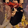 puppy, dog, plush_toy, snoopy, blanket, container, stuffed_animal, black_and_white, sleeping, cozy, soft, toy_bone, fabric, pattern, resting, indoor, cute, animal, pet, snuggle