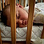 Gia joined the competition — help win amazing prizes! baby, sleeping, crib, wooden_bars, mattress, pajamas, infant, face, peaceful, child, bedroom, rest, close_up, indoors, cute, soft_lighting, cozy, calm, newborn, toddler