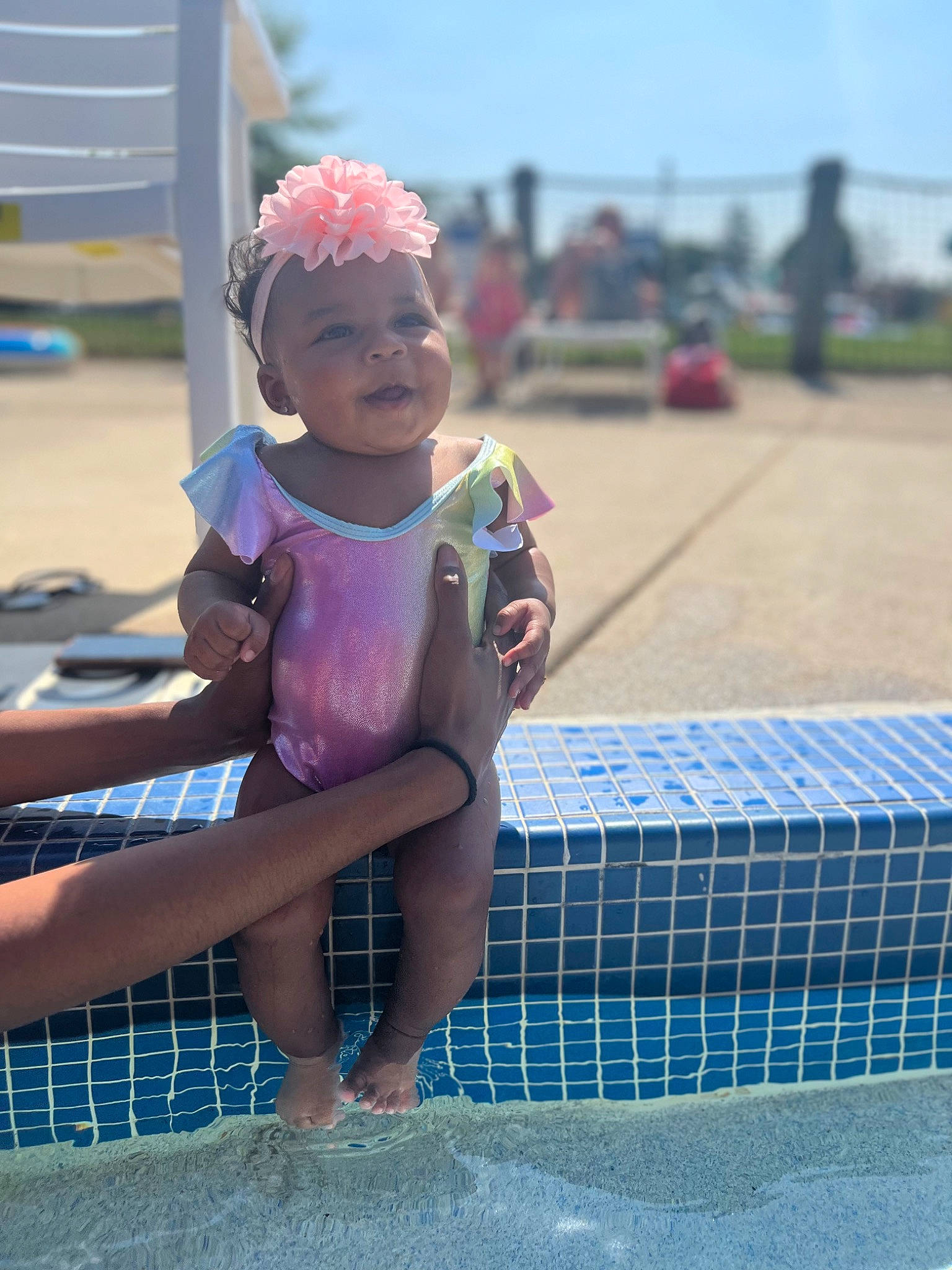 Azuri joined the competition — help win amazing prizes! barefoot, beach, body_of_water, child, foot, fun, happy, hat, headwear, human_leg, leisure, person, personal_protective_equipment, play, recreation, sand, sitting, sky, summer, thigh