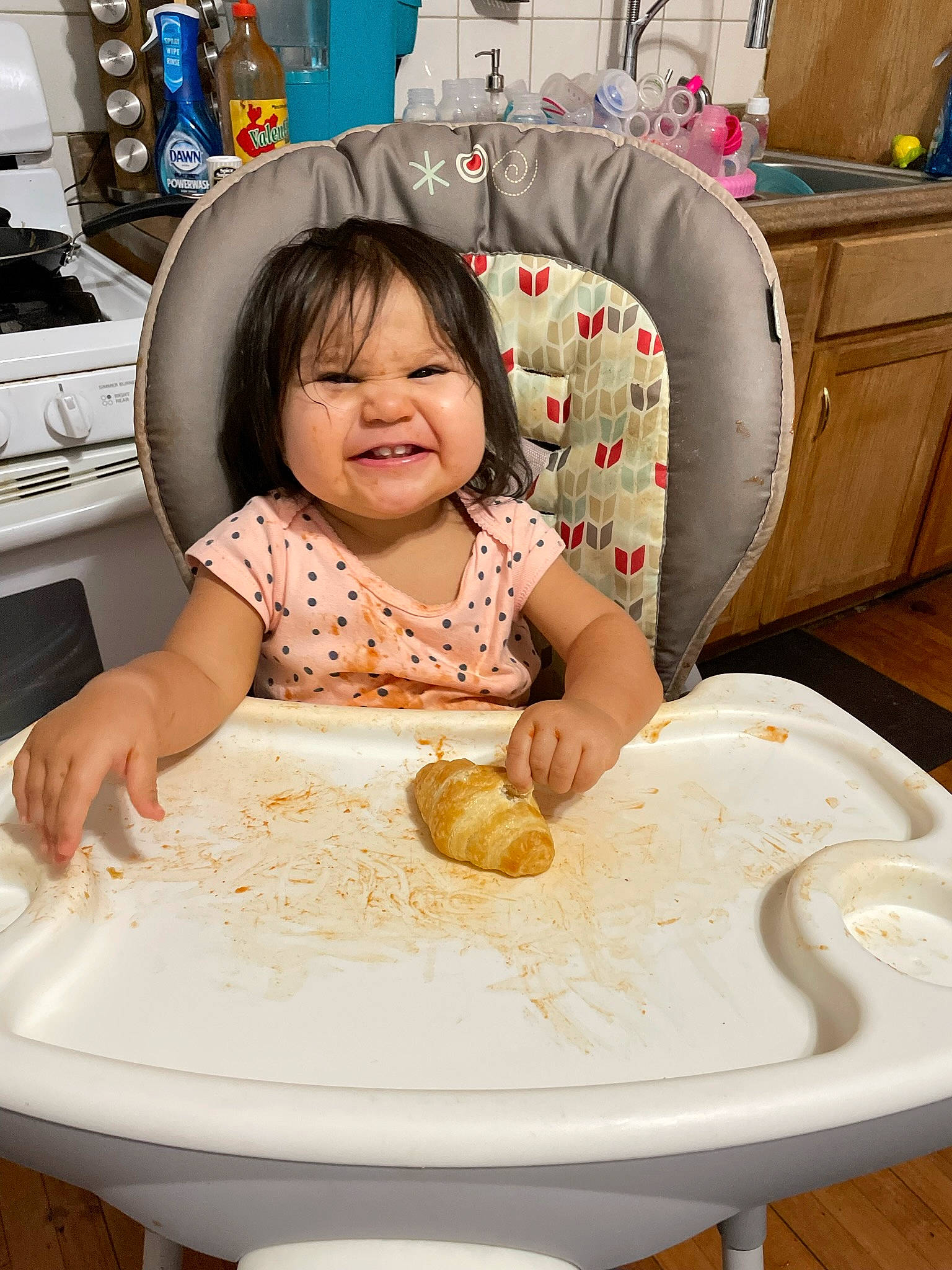 Kensi is registered to the contest to win money with this photo: baking, child, comfort_food, cuisine, dish, dishware, eating, food, happy, ingredient, person, plate, product, serveware, shirt, smile, t_shirt, table, tableware, toddler