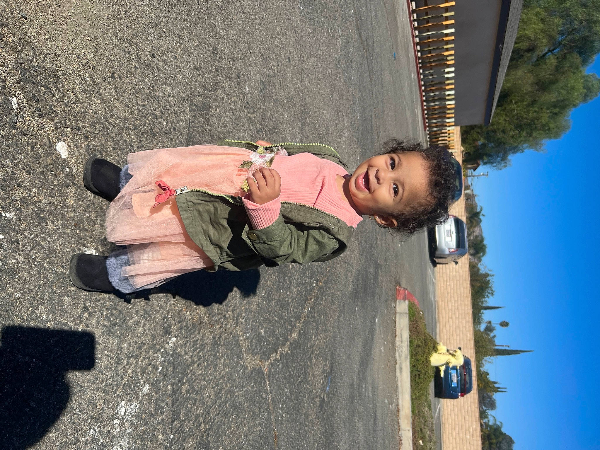 Ayla joined the competition — help win amazing prizes! asphalt, concrete, fun, human_leg, joy, landscape, leaf, leisure, person, plant, road, road_surface, shadow, sidewalk, sitting, sky, street, tints_and_shades, toddler, travel