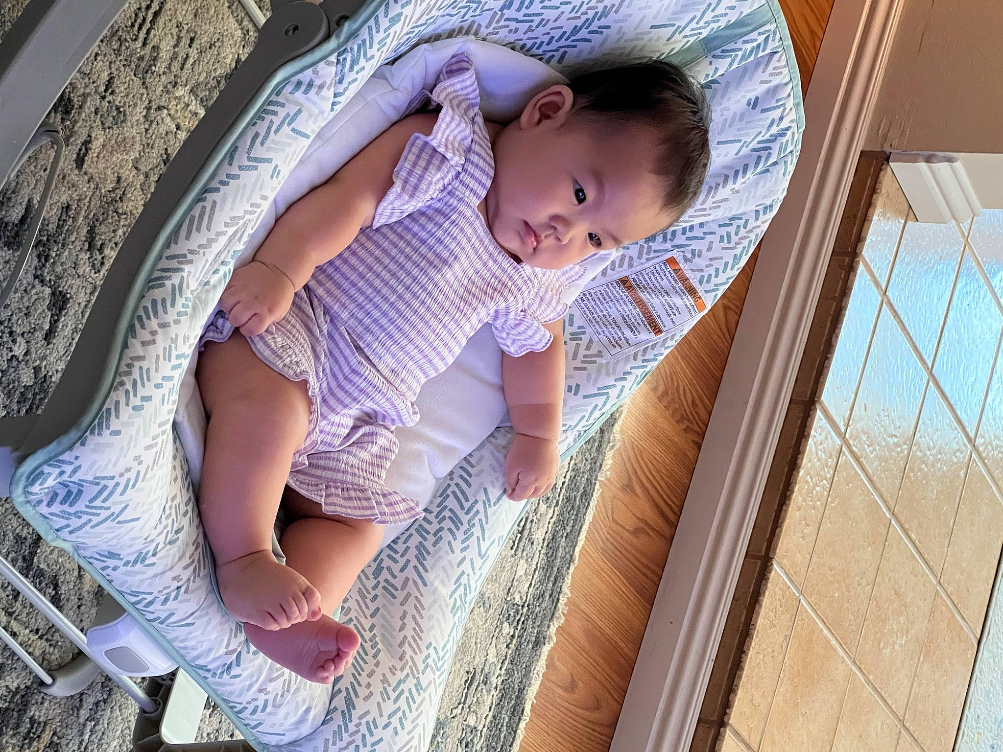 Rhylee is registered to the contest to win money with this photo: baby, baby_products, baby_toddler_clothing, child, comfort, finger, fun, hand, happy, human_leg, leg, leisure, pattern, person, purple, sitting, skin, thigh, tints_and_shades, toddler