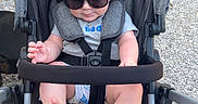 Hendrick joined the competition — help win amazing prizes! baby, casual_clothing, child, cute, fashion, feet, grass, gravel, hands, head, infant, outdoor, person, relaxing, seatbelt, shade, stroller, summer, sunglasses, sunny