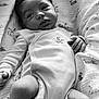 baby, black_and_white, blanket, bunny, child, cozy, cute, diaper, face, hand, indoor, infant, legs, lying_down, newborn, onesie, pattern, portrait, sleepwear, soft_lighting