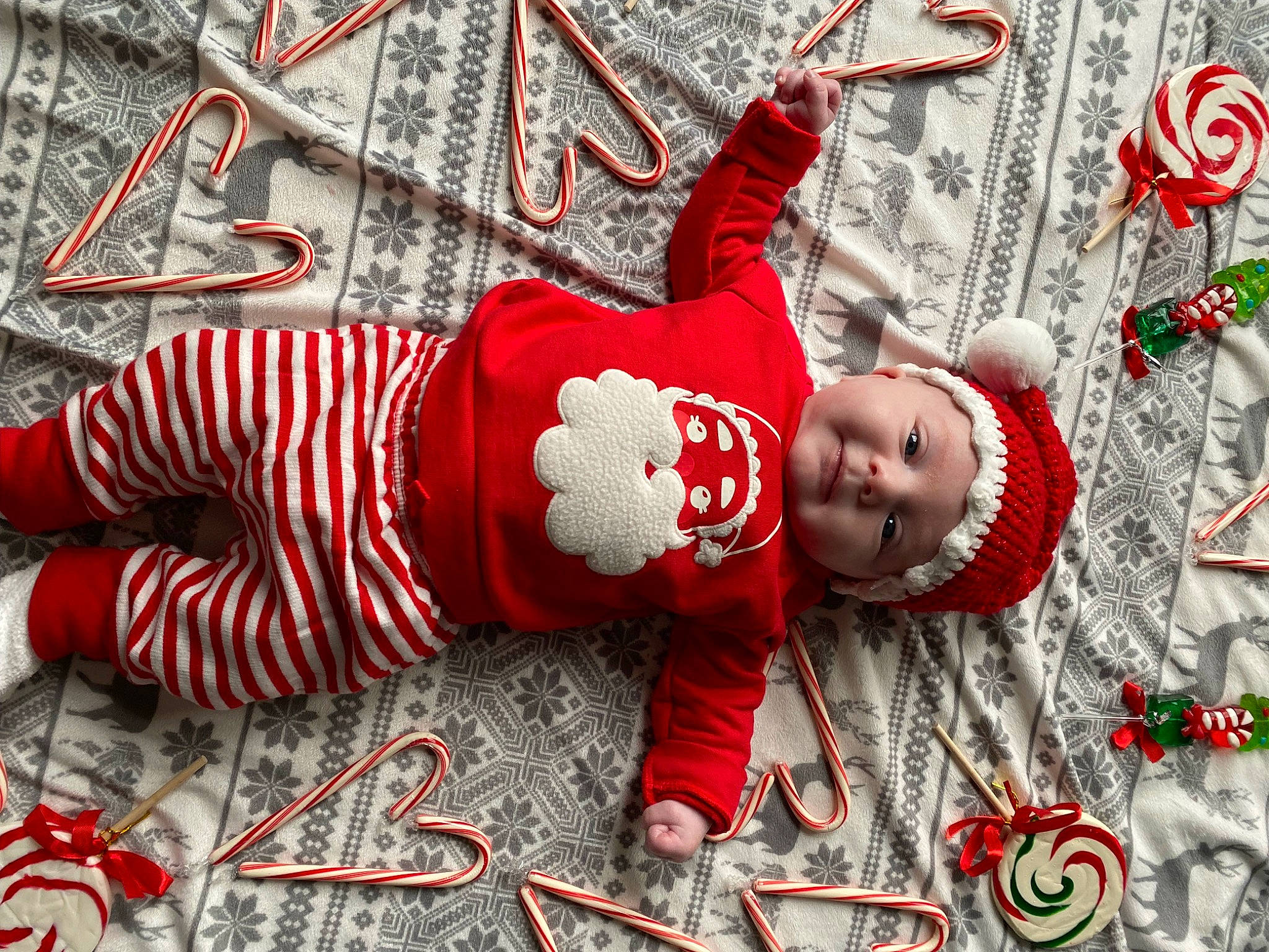 Lennox is registered to the contest to win money with this photo: baby, baby_toddler_clothing, child, christmas, christmas_decoration, christmas_eve, christmas_ornament, event, font, fun, grass, happy, headwear, holiday, ornament, pattern, person, photography, red, smile