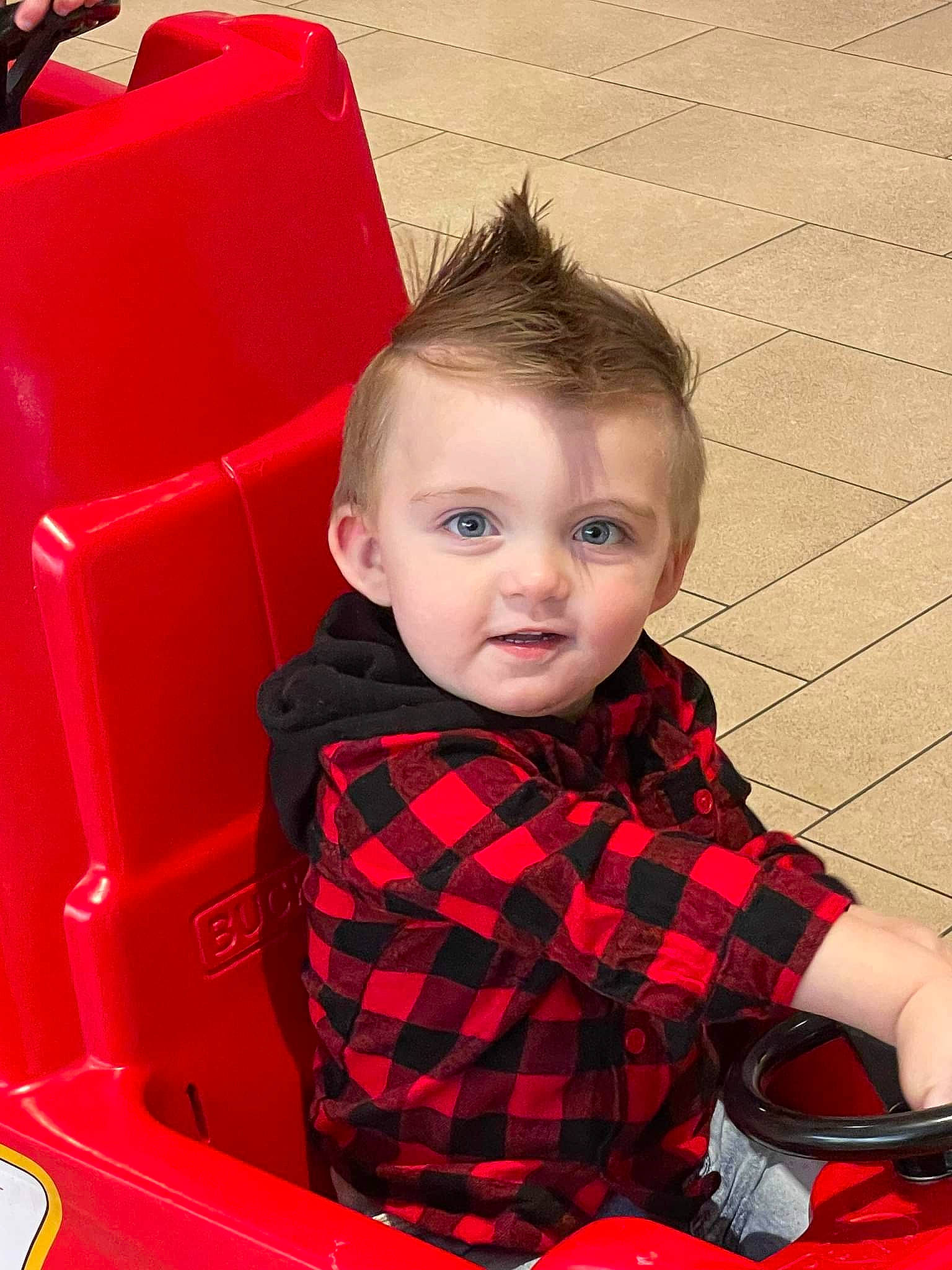 John joined the competition — help win amazing prizes! automotive_exterior, automotive_lighting, baby_toddler_clothing, bumper, carmine, child, fun, happy, hood, pattern, person, plaid, product, red, sitting, skin, sleeve, t_shirt, tartan, toddler