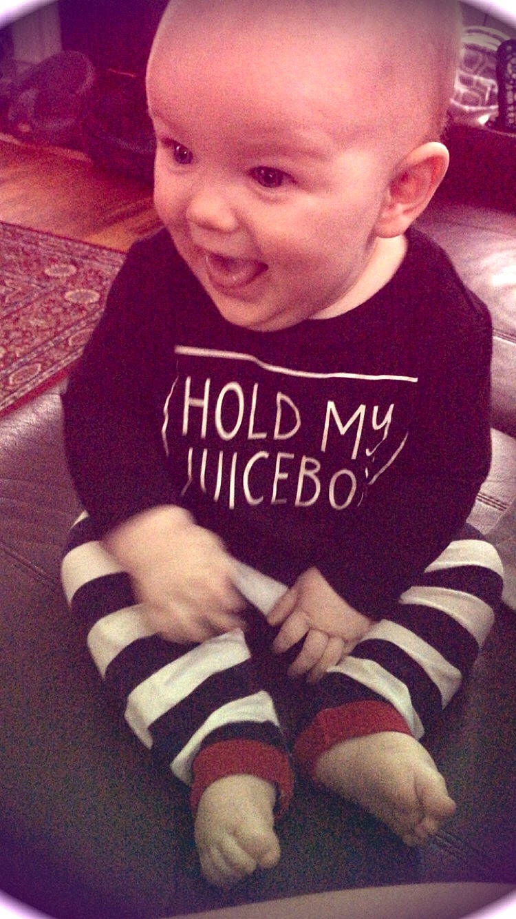 Braiden is registered to the contest to win money with this photo: baby, baby_toddler_clothing, cheek, child, cool, face, facial_expression, head, laugh, person, sitting, skin, sleeve, smile, t_shirt, toddler