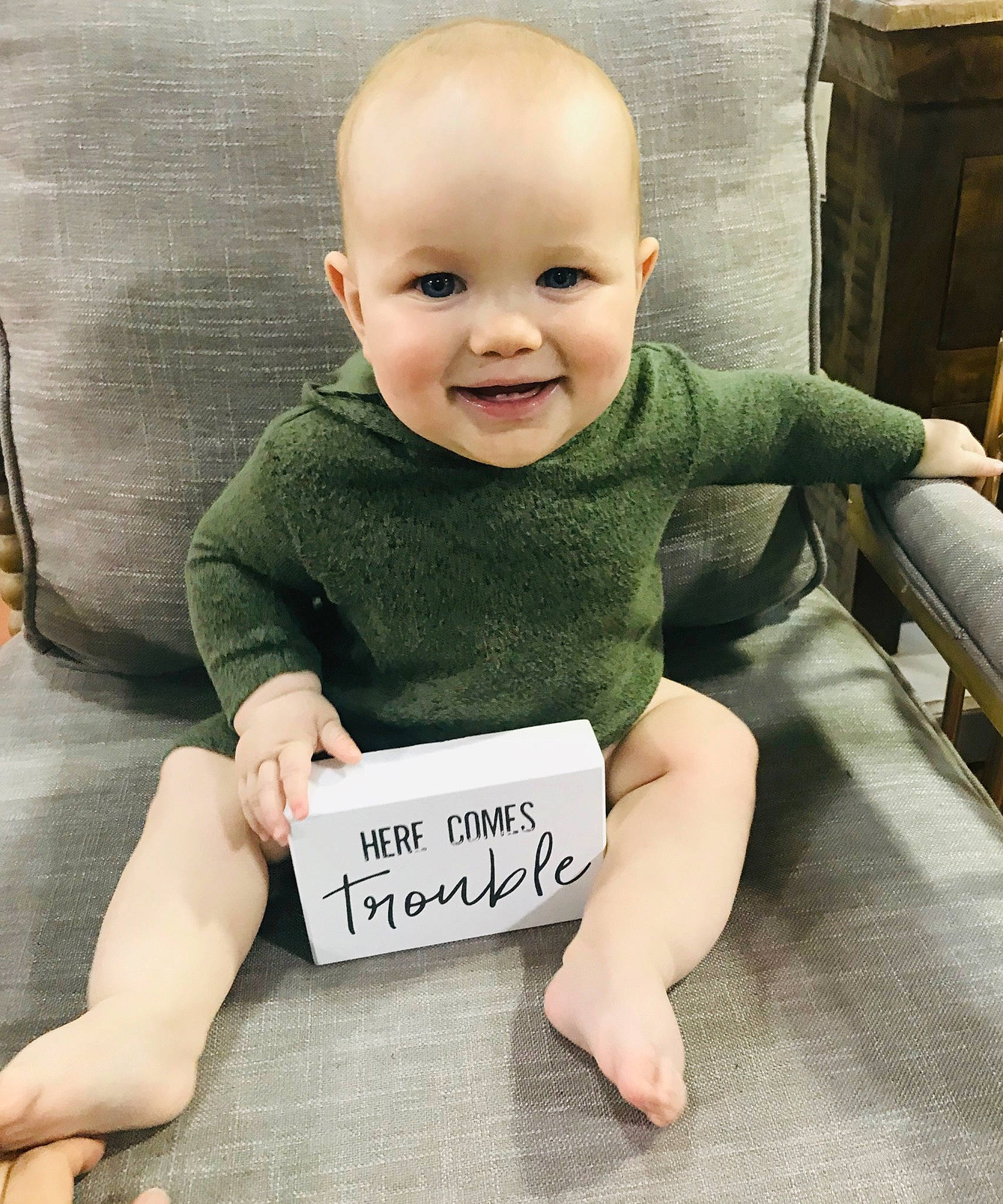 Braiden is registered to the contest to win money with this photo: arm, baby, baby_products, baby_toddler_clothing, child, face, head, joy, person, photo_caption, product, sitting, skin, smile, toddler, tummy_time