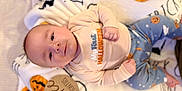 Brooks Bennett joined the competition — help win amazing prizes! baby, infant, lying_down, blanket, pumpkin, halloween, pajamas, cute, child, smiling, face, wooden_sign, age_marker, orange, blue, white, decorations, holiday, seasonal, festive