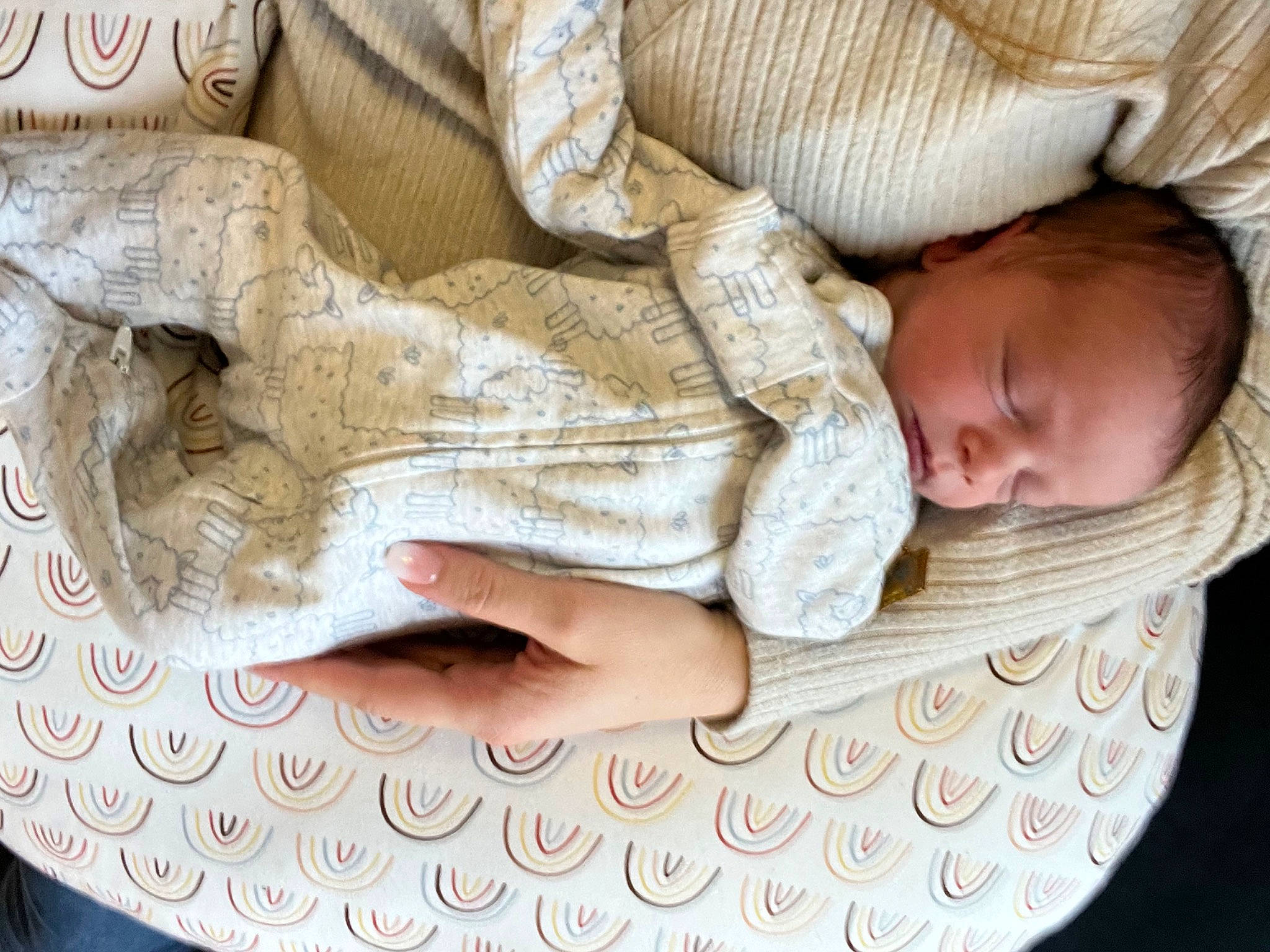 Niko is registered to the contest to win money with this photo: baby, baby_safety, baby_sleeping, baby_toddler_clothing, beige, child, comfort, finger, gesture, hand, infant_bed, linens, pattern, person, product, skin, sleeve, toddler, white, wood