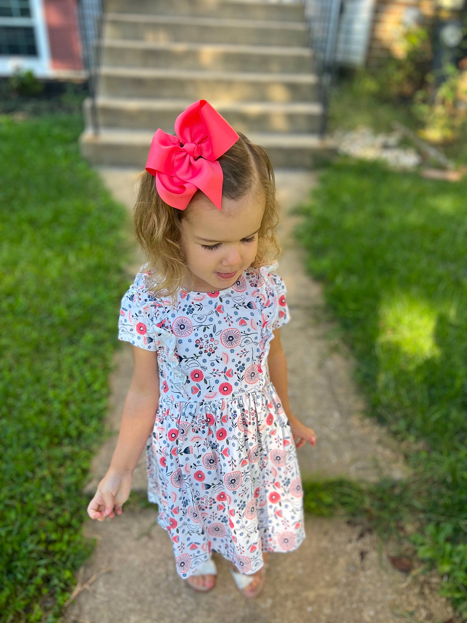 Sofia joined the competition — help win amazing prizes! baby_toddler_clothing, child, dress, face, fun, grass, hair, happy, head, leaf, magenta, one_piece_garment, pattern, people_in_nature, person, petal, pink, plant, sleeve, summer