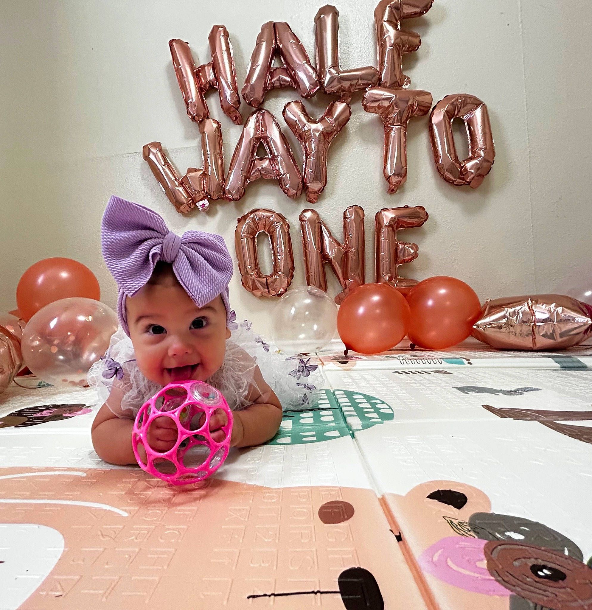 Makynzi is registered to the contest to win money with this photo: art, carmine, child, design, event, flooring, font, happy, holiday, illustration, magenta, material_property, party_supply, pattern, person, pink, room, sweetness, table, textile
