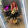 Waffle joined the competition — help win amazing prizes! woman, dog, mirror, salon, chair, red_hair, tattoos, phone, reflection, plants, cabinet, floor, boots, leggings, christmas_tree, coat, table, indoor, wood_floor, casual